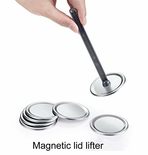 Hand using magnetic lid lifter with jar lids.