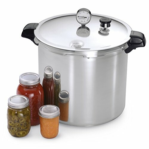 Pressure canner with various jars of preserved food.