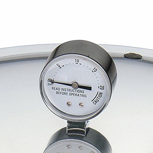 Pressure cooker gauge with caution reading.